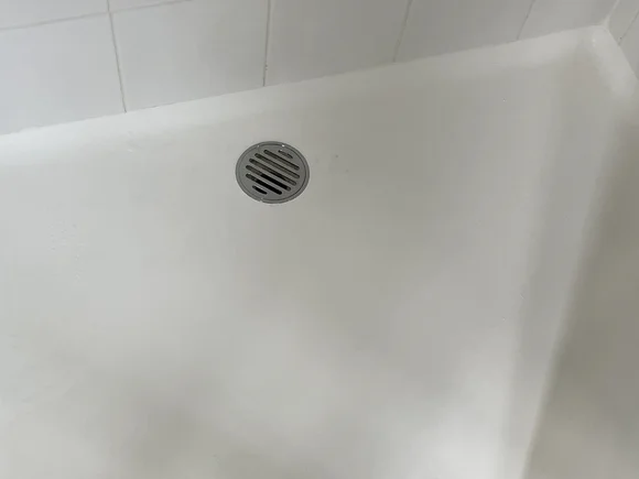 Repaired shower base looking brand new