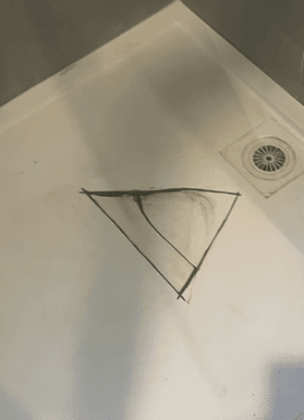 Shower repair started by cutting out the crack