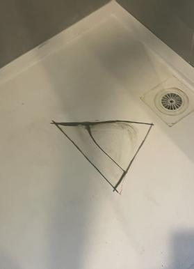 Cracked shower base marked out for repair
