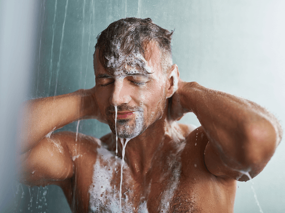 Man enjoying his newly fixed shower